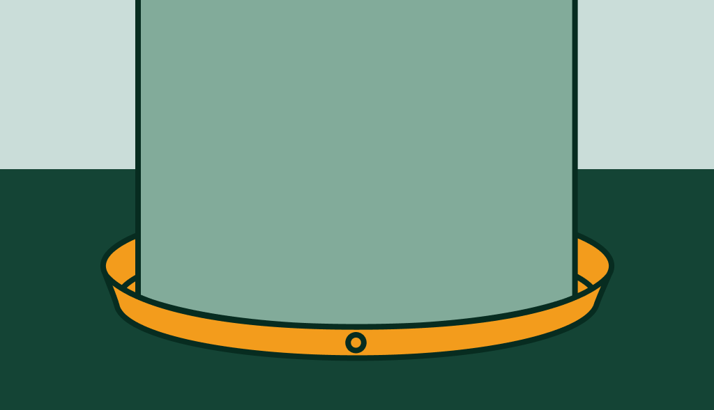 Water heater sitting in an orange drain pan, showing how a water heater pan helps prevent water damage.