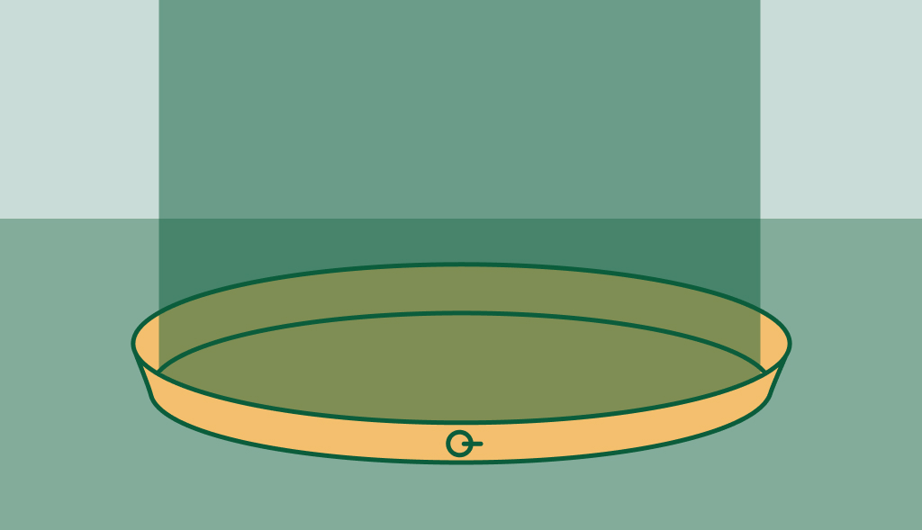Illustration of a water heater pan placed on the ground, protecting against potential leaks.