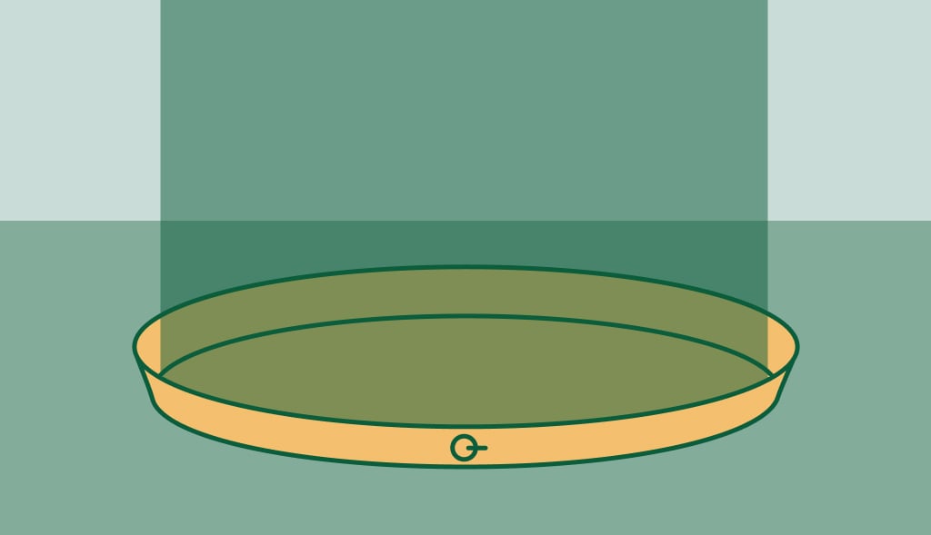 Illustration of a water heater pan placed on the ground, protecting against potential leaks.