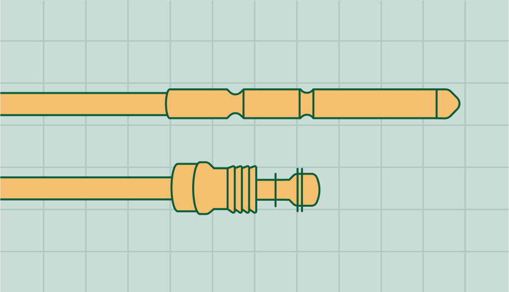 A close-up view of a water heater thermocouple, with its copper rod and ceramic insulator clearly visible.