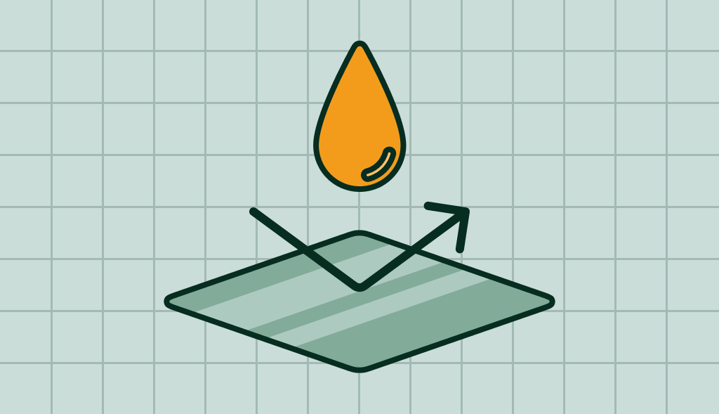 A water drop on a metal slab, with an arrow going at a 90 degrees angle.