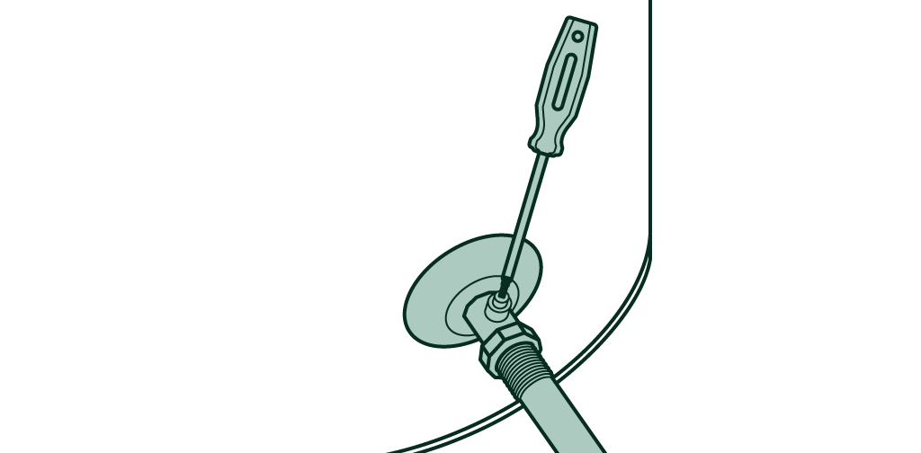 Destornillador girando una válvula para cerrar el suministro de agua en un calentador.